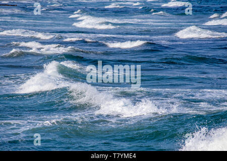 Waves breaking on a beach Stock Photo