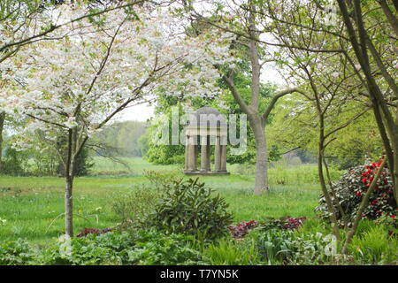 The Temple of the Winds at Doddington Hall and Gardens, Lincolnshire seen through cherry blossoms in mid spring. England, UK Stock Photo