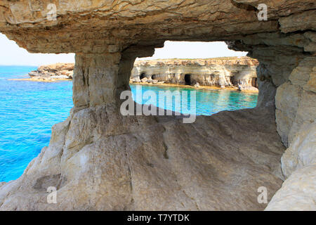 The Sea Caves near Cape Greco, Cyprus with a view at a beautiful turquoise bay Stock Photo