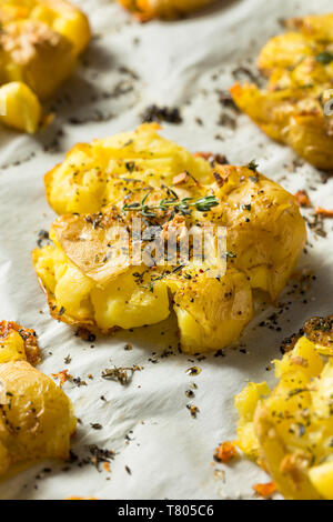 Homemade Smashed Potatoes with Garlic Salt and Thyme Stock Photo