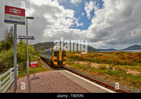 SCOTRAIL KYLE LINE INVERNESS TO KYLE OF LOCHALSH SCOTLAND ATTADALE STATION TRAIN APPROACHING FROM KYLE OF LOCHALSH Stock Photo