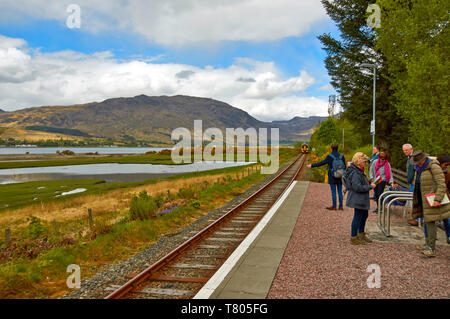 Train on the Inverness to Kyle of Lochalsh railway rounding the coast ...