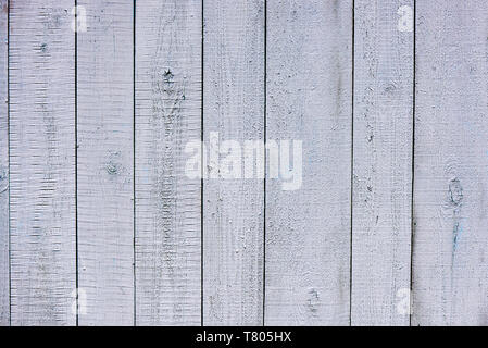 Background texture of the old wood covered with faded and cracked paint. Stock Photo