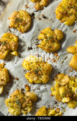 Homemade Smashed Potatoes with Garlic Salt and Thyme Stock Photo