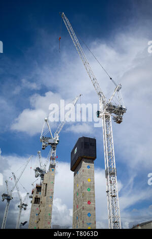 Cranes constructing new buildings along Kings Boulevard in Kings Cross as part of the continuing redevelopment of the area Stock Photo