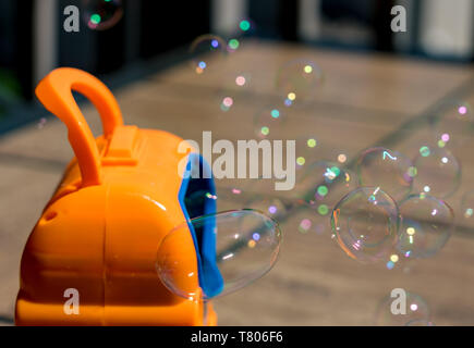 Childs mechanical soap bubble maker or blower Stock Photo