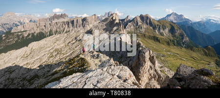 Hiking in typical mountainous terrain of the Dolomites range of the Alps on the Alta Via 1 trekking route near Rifugio Nuvolau, Belluno, Veneto, Italy Stock Photo