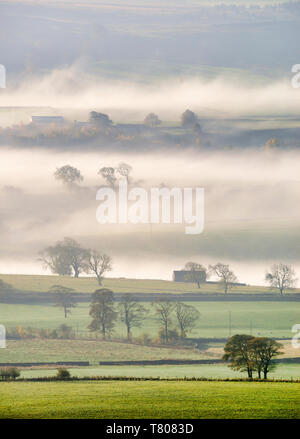 Mist rising over East Halton and Embsay in Lower Wharfedale, North Yorkshire, Yorkshire, England, United Kingdom, Europe Stock Photo