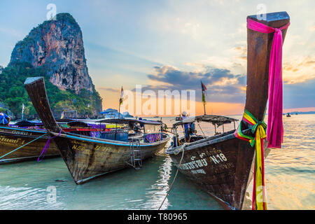 Long tail boats at sunset on Railay beach in Railay, Ao Nang, Krabi Province, Thailand, Southeast Asia, Asia Stock Photo