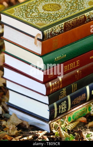 Books of the three monotheistic religions, Christianity, Islam and Judaism, the Torah, Quran and Bible, France, Europe Stock Photo