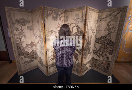 Christie’s, London, UK. 10th May 2019. Christie’s Spring Asian Art Auction preview brings together three Chinese auctions to be held on 14 May, with works spanning imperial porcelain, Buddhist bronzes, Yixing pottery, jade carvings, snuff bottles, textiles and paintings. Image: A rare inscribed and dated Six-Panel Lacquer Screen, 6th Year of the Wanli Period, corresponding to 1579. Estimate £80,000-120,000. Credit: Malcolm Park/Alamy Live News. Stock Photo