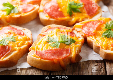 Texas toasts with sausage and melted cheddar cheese close-up on the table. horizontal Stock Photo