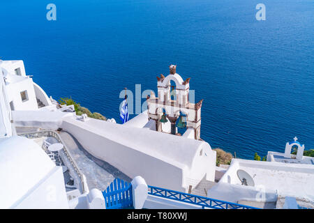 Traditional old Bell Tower against blue sea in Oia, Santorini, Greece Stock Photo