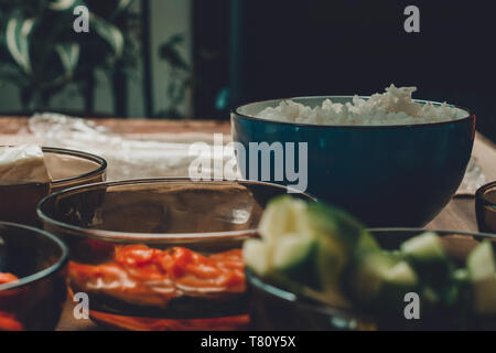 Bright tasty products in plates on the table as ingredients for the preparation of sushi shooting from the top viewpoint 2019 Stock Photo