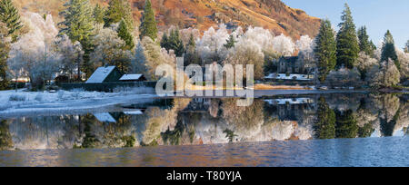Loch Ard partially frozen over and a hoar frost around Aberfoyle in the Loch Lomond and the Trossachs National Park in mid-winter, Scotland, UK Stock Photo