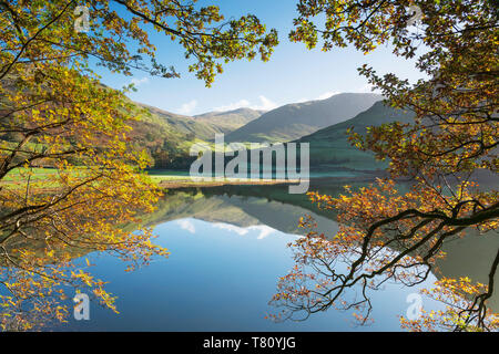 Autumn colours and clear reflections in Brothers Water, Lake District National Park, UNESCO World Heritage Site, Cumbria, England, UK Stock Photo