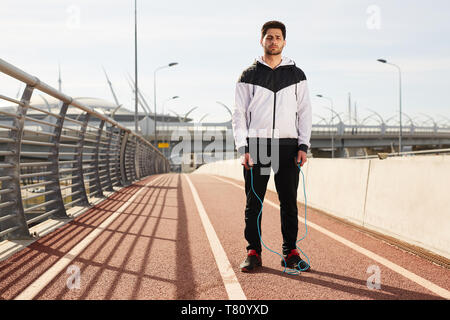 Man with skipping rope Stock Photo