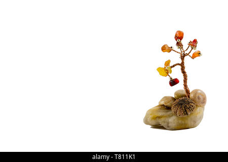 crystal stone with seashells and copper wire tree with colored stones - tree of life Stock Photo
