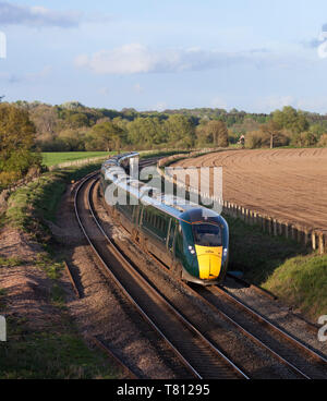 2 First Great Western railway class 800 Bi-mode Intercity Express trains passing Wooton Rivers, Wiltshire Stock Photo