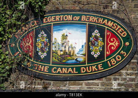 Colourful plaque on stone bridge over Grand Union Canal Berkhamsted Hertfordshire England