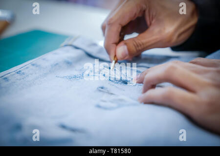 Arts and decoration blue jean by paint, pull thread. Stock Photo