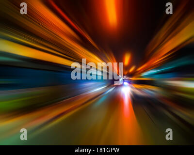 Abstract speed motion blur in city on night road and neon light. Stock Photo