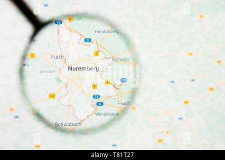 Nuremberg city in Germany, Bavaria visualization illustrative concept on screen through magnifying glass Stock Photo