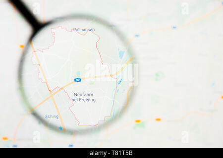 Neufahrn bei Freising city in Germany, Bavaria visualization illustrative concept on screen through magnifying glass Stock Photo