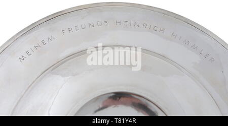 Heinrich Himmler - Joachim von Ribbentrop, a presentation silver salver. Presented to Heinrich Himmler by Joachim von Ribbentrop on Christmas 1940. '925' silver, diameter 45 cm and weight 1360g. Finely engraved on the obverse upper rim with SS runes (3 cm high). Engraved on the upper reverse rim in block letters 'MEINEM FREUNDE HEINRICH HIMMLER' (1 cm high). Around the lower reverse rim, engraved signature of 'Joachim V. Ribbentrop' (1.5 cm high). Below it in block letters 'Weihnachten 1940' (0.5 cm high). The centre of the reverse is stamped with a crescent and crown '925', Editorial-Use-Only Stock Photo