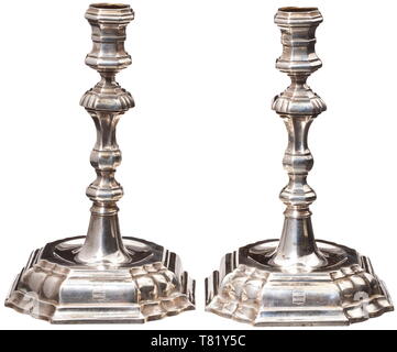 A pair of large German pricket candlesticks, circa 1600 Brass candle  holders cast in one piece. Tiered bell-shaped feet, the stems segmented by  balusters and widely drip-pans. Forged, iron prickets on riveted