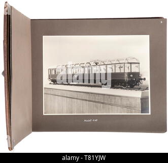 A photo album of Adolf Hitler's lounge- and sightseeing carriage. Inscribed, large-format album with brown leather cover, within which are 54 images in 9 x 14 cm to 17 x 23 cm sizes detailing the lounge carriage of Reich Chancellor A. Hitler (the so-called 'Führeraussichtswagen'). The photos are indoor shots, of the guest book and (for the period) of the modern vehicle engineering (complete glazing). Album dimensions 33 x 25 cm. The carriage (factory designation Bln 10 282) was built by the Fuchs firm in Heidelberg and is in private possession today. historic, historical, 2, Editorial-Use-Only Stock Photo