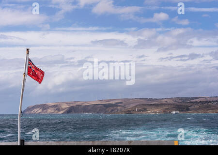 The Australian Red Ensign waving on the ferry that connects Cape Jervis to Penneshaw, Kangaroo Island, Southern Australia Stock Photo