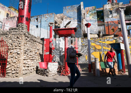 There is street art all over dilapidated Havana,on some streets the artist lives but forget galleries its on the street walls. Stock Photo