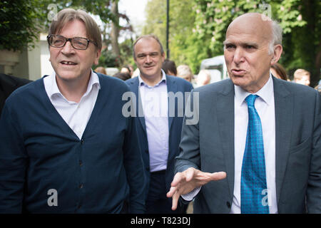 (left to right) European Parliament's Brexit co-ordinator Guy Verhofstadt, walks with Ed Davey, Lib Dem MP for Kingston & Surbiton and Lib Dem leader Sir Vince Cable in London during their EU election campaign. Stock Photo