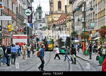 LINZ, AUSTRIA - AUGUST 5, 2008: People visit the Old Town in Linz, Austria. It is the capital city of Upper Austria region and the 3rd largest town in Stock Photo