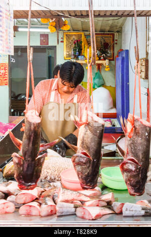 Bangkok, Thailand - April 21st 2011. Fish heads on a fishmongers stall. Fish is a popular food. Stock Photo