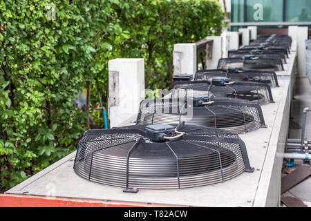 Row air compressor with fan blowing to the top Stock Photo