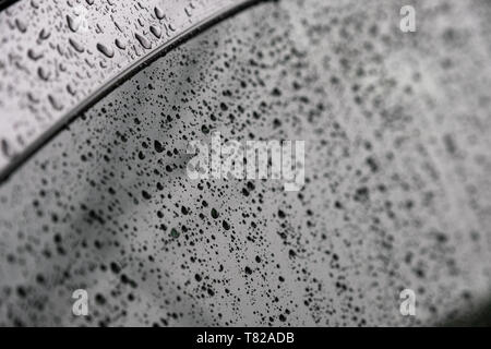 Close-up Raindrops on the windshield in rainy season Stock Photo