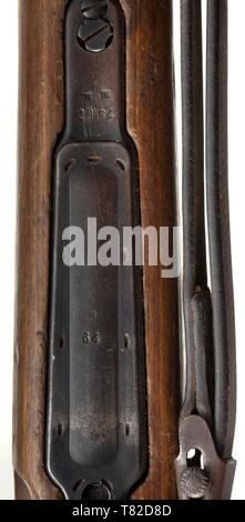 A scope rifle 98 k, Mauser, with high top-hinged mount and scope Dialytan, cal. 8 x 57, no. 42064d. Matching numbers. Mirror-like bore. Code on receiver head covered by front mount base, but various acceptance marks eagle/'135'. According to serial number manufactured after 1944 at Mauser-Werke AG, Oberndorf. Sheet steel-stamped magazine plate. Original finish, partially thin and somewhat spotted. Dark laminated stock without external number, not taken apart. Complete with strapping, pitted cleaning rod and front sight guard. Mounted with high to, Additional-Rights-Clearance-Info-Not-Available Stock Photo