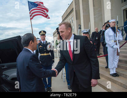 Japanese Chief Cabinet Secretary Yoshihide Suga speaks to reporters at ...