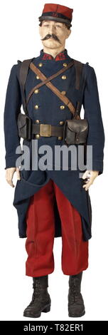 A uniform for a soldier in the 16th Infantry Regiment Kepi M 1884 of red and dark blue woolen cloth with dark blue piping, sewn-in regimental number, black leather visor (old sewn repair), leather chin strap, coarse linen liner (stamped). Included is the uniform tunic for enlisted men of dark blue woolen cloth with red collar patches (regimental number) and two rows of brass buttons, with grenade symbols (gilt vestiges), and the trousers of red woolen material with black lace-up boots. Additionally, a brown leather belt with brass buckle and an e, Additional-Rights-Clearance-Info-Not-Available Stock Photo