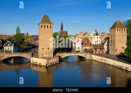 France, Bas Rhin, Strasbourg, old town listed as World Heritage by UNESCO, Petite France District, defensive towers of the covered bridges and Notre Dame Cathedral in the background Stock Photo