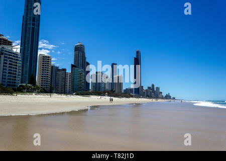 Visitors on main beach in Surfers Paradise.It one of Australia's iconic coastal tourist destinations, drawing 10 million tourists every year from all  Stock Photo