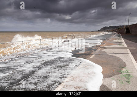 Waves crashing on Colwyn Bay seawall in a storm at high tide Stock Photo