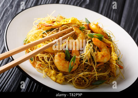 Stir-fried chow Mei Fun close-up on a plate on the table. horizontal Stock Photo