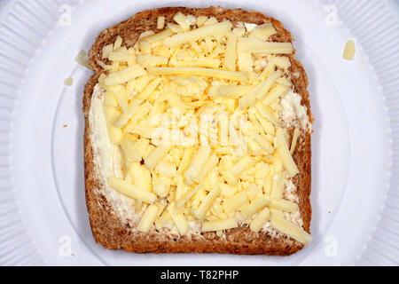 Grated cheddar cheese with Branston pickle on wholemeal bread Stock Photo
