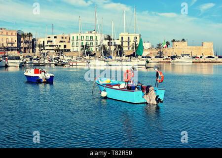 Fishing boats in the old harbor of Bari on the Adriatic sea coast, Puglia region, Italy. Stock Photo