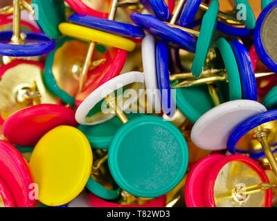 Group of colorful multi - colored pushpins. Close up macro photo. Stock Photo