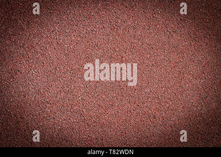 red background with spotlight. Asphalt texture background. Stock Photo
