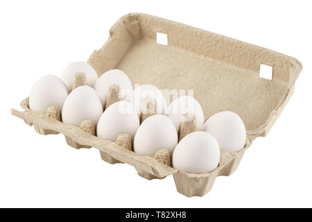 Cardboard egg box with ten eggs isolated on white. Stock Photo